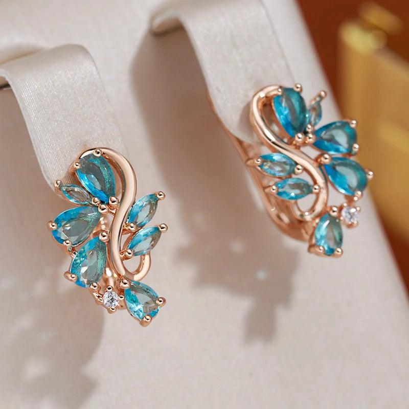 New Personality 14K Rose Gold Rolled Bright Blue AAA Zircon Crystals Hollow Charm Curve Symmetrical Buckle Earrings