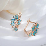 New Personality 14K Rose Gold Rolled Bright Blue AAA Zircon Crystals Hollow Charm Curve Symmetrical Buckle Earrings