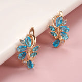 New Personality 14K Rose Gold Rolled Bright Blue AAA Zircon Crystals Hollow Charm Curve Symmetrical Buckle Earrings