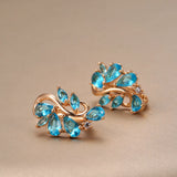 New Personality 14K Rose Gold Rolled Bright Blue AAA Zircon Crystals Hollow Charm Curve Symmetrical Buckle Earrings