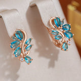 New Personality 14K Rose Gold Rolled Bright Blue AAA Zircon Crystals Hollow Charm Curve Symmetrical Buckle Earrings